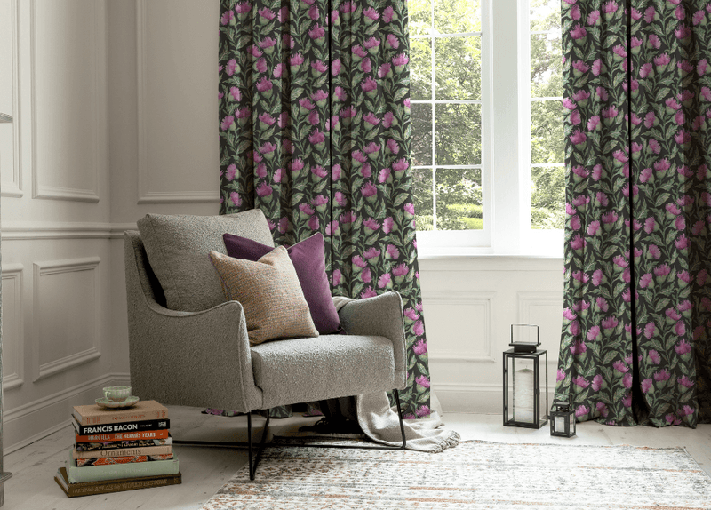 floral curtains on a pole by a window