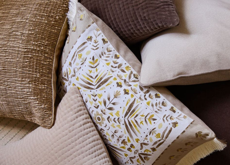 A zoomed in image of a collection of autumnal cushions